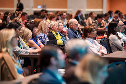 People attending a conference session